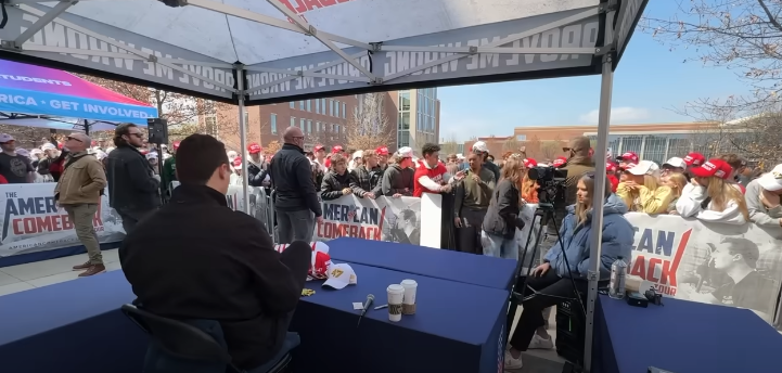 Screen Shot from a YouTube Video of right wing personality Charlie Kirk letting College kids walk up and debate him.